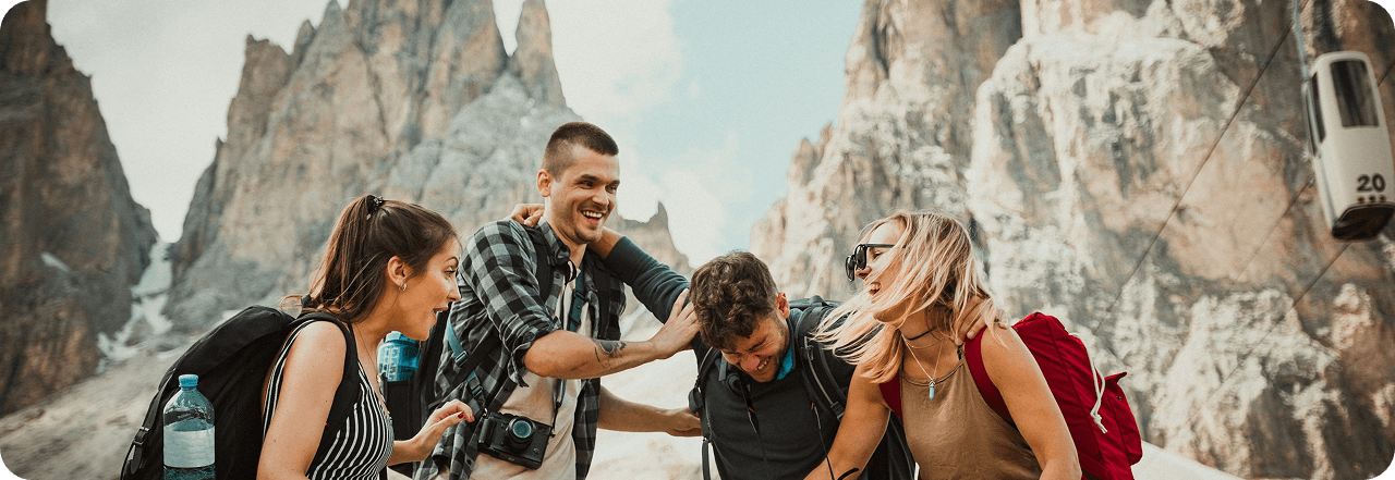 Group of friends hiking in mountains